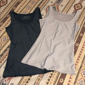 Tape measure shaping tanks. Size small.